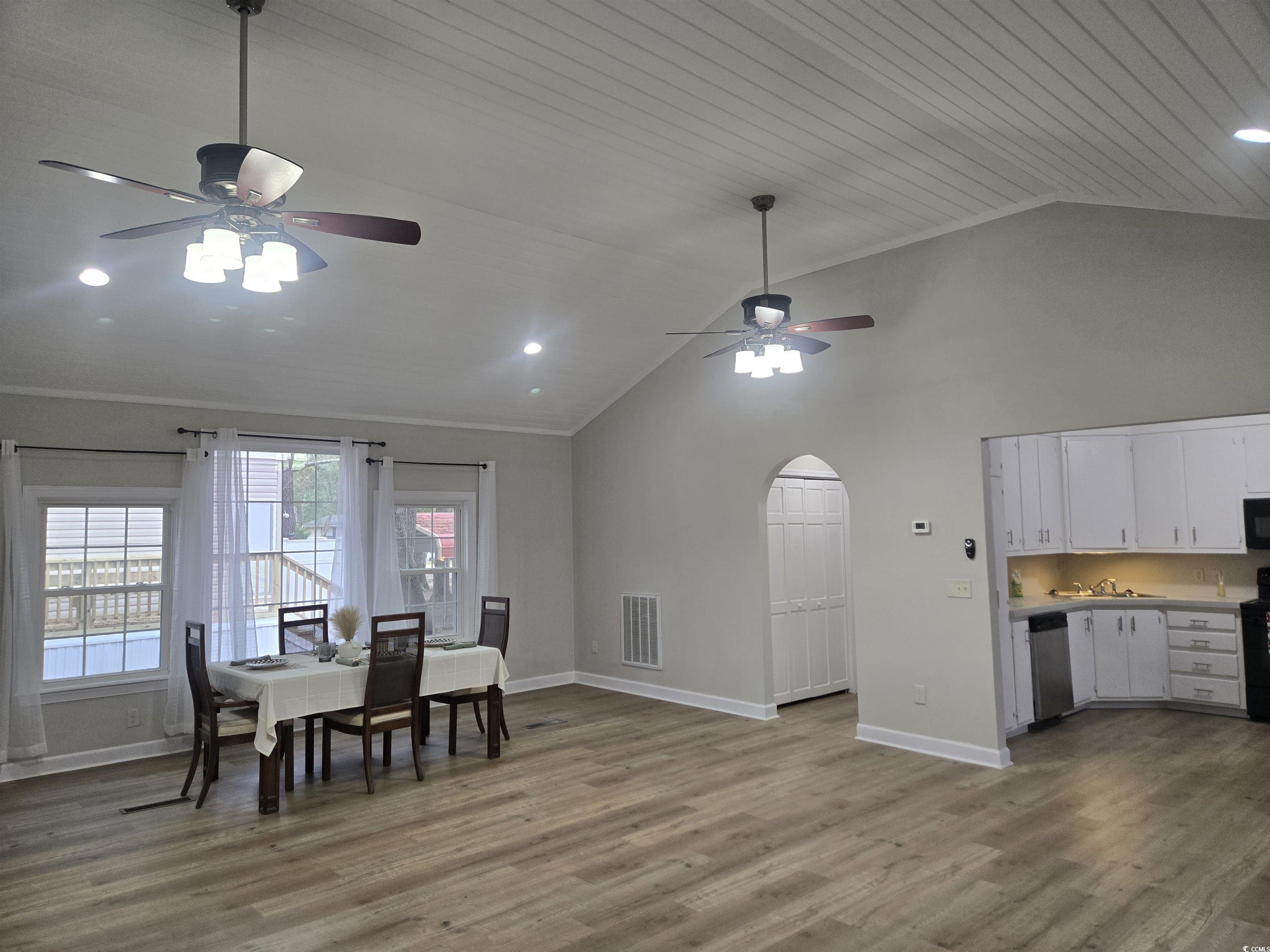 517 Porter Drive Murrells Inlet, SC 29576 - Photo 13 of 40 Dining room with ceiling fan, arched walkways, light wood finished floors, recessed lighting, and wooden ceiling