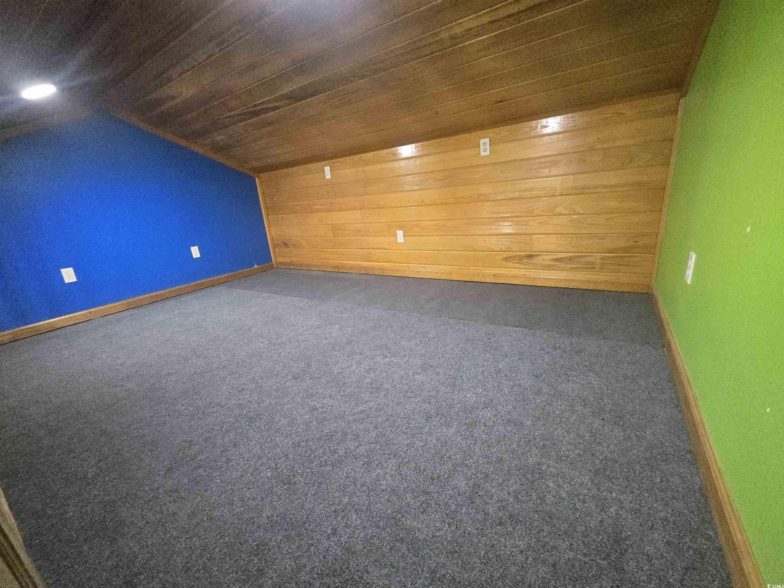 517 Porter Drive Murrells Inlet, SC 29576 - Photo 23 of 40 Bonus room with wooden walls, dark carpet, and wooden ceiling