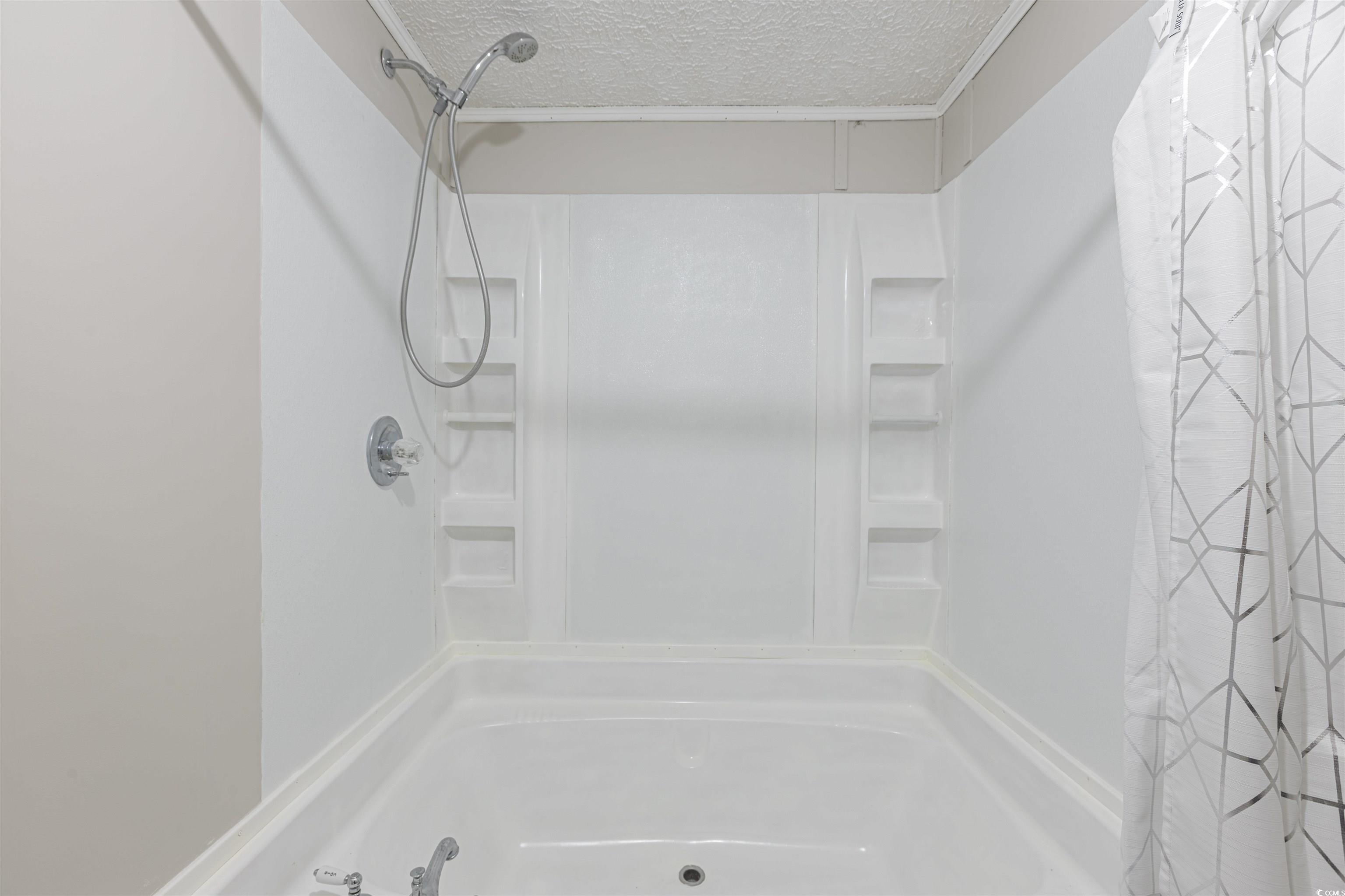 517 Porter Drive Murrells Inlet, SC 29576 - Photo 37 of 40 Full bath featuring a textured ceiling, shower / bath combo, and ornamental molding