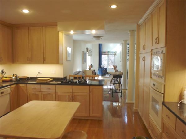 6 Valley View Road Weston, MA 02493 - Photo 11 of 28 a large kitchen with lots of counter top space and stainless steel appliances