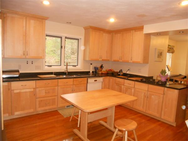 6 Valley View Road Weston, MA 02493 - Photo 12 of 28 a kitchen with stainless steel appliances granite countertop a sink a stove and white cabinets