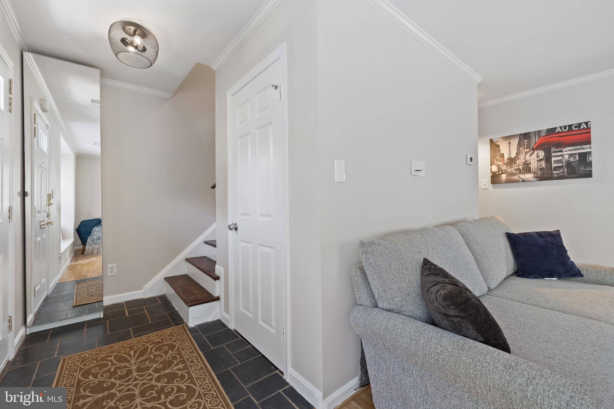 6721 Kenwood Forest Lane, Unit 45 Chevy Chase, MD 20815 - Photo 14 of 35 a living room with furniture and a rug