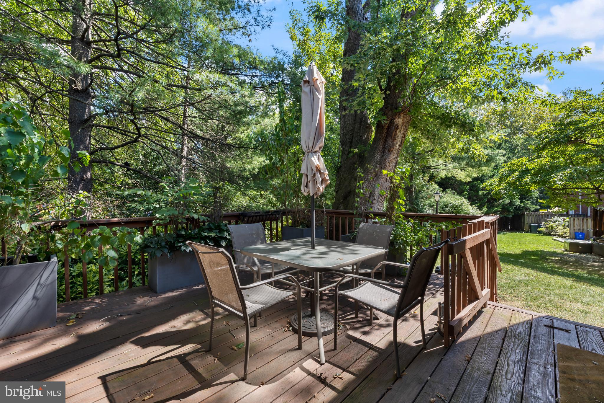 6721 Kenwood Forest Lane, Unit 45 Chevy Chase, MD 20815 - Photo 2 of 35 a view of backyard with hardwood and deck