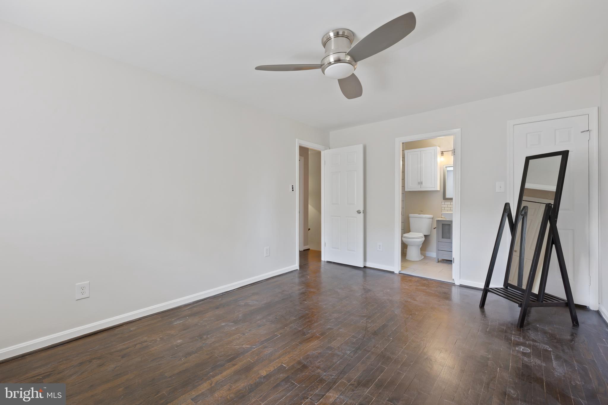 6721 Kenwood Forest Lane, Unit 45 Chevy Chase, MD 20815 - Photo 21 of 35 a view of an empty room and wooden floor