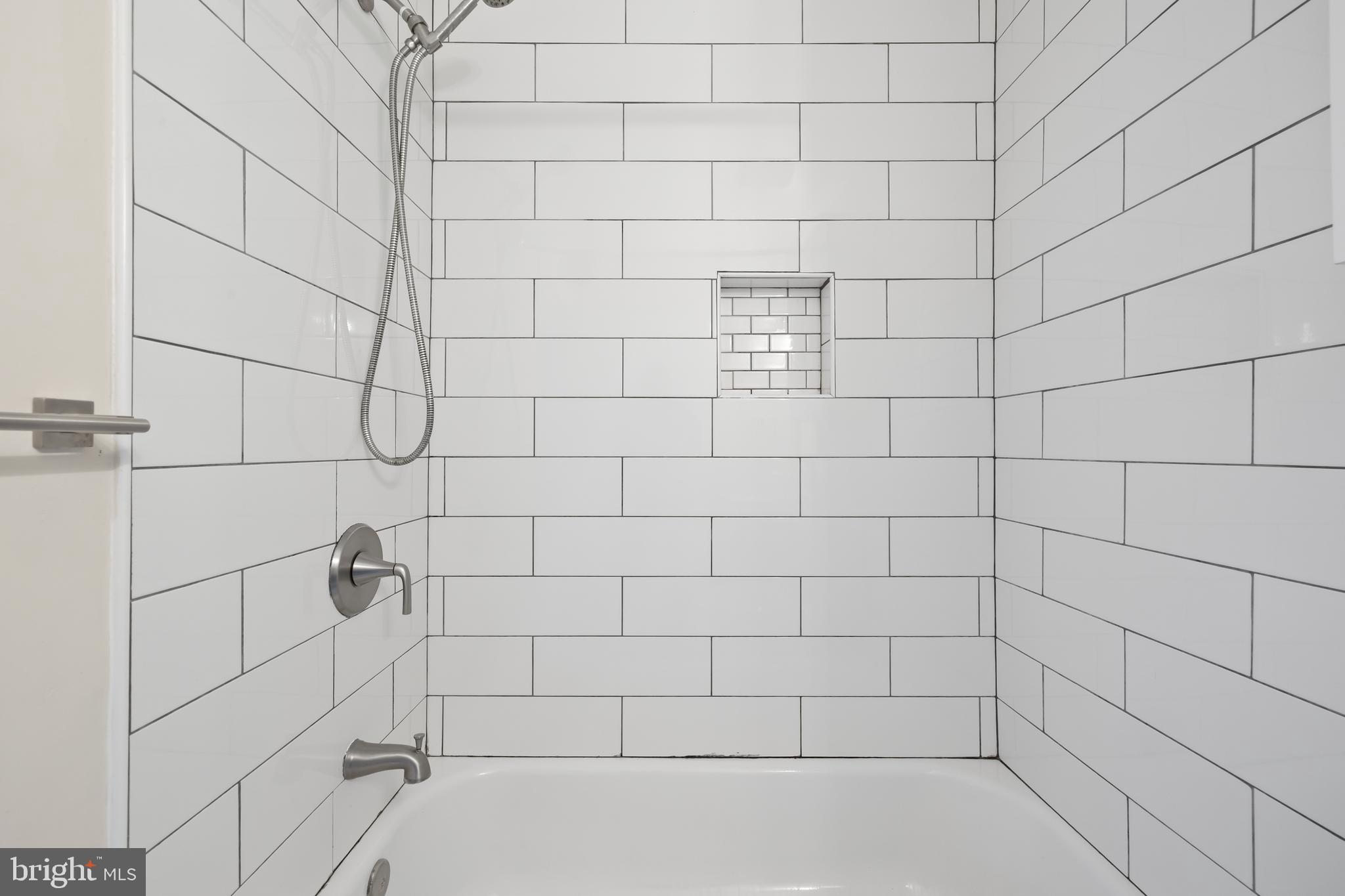 6721 Kenwood Forest Lane, Unit 45 Chevy Chase, MD 20815 - Photo 23 of 35 a bathroom with a shower