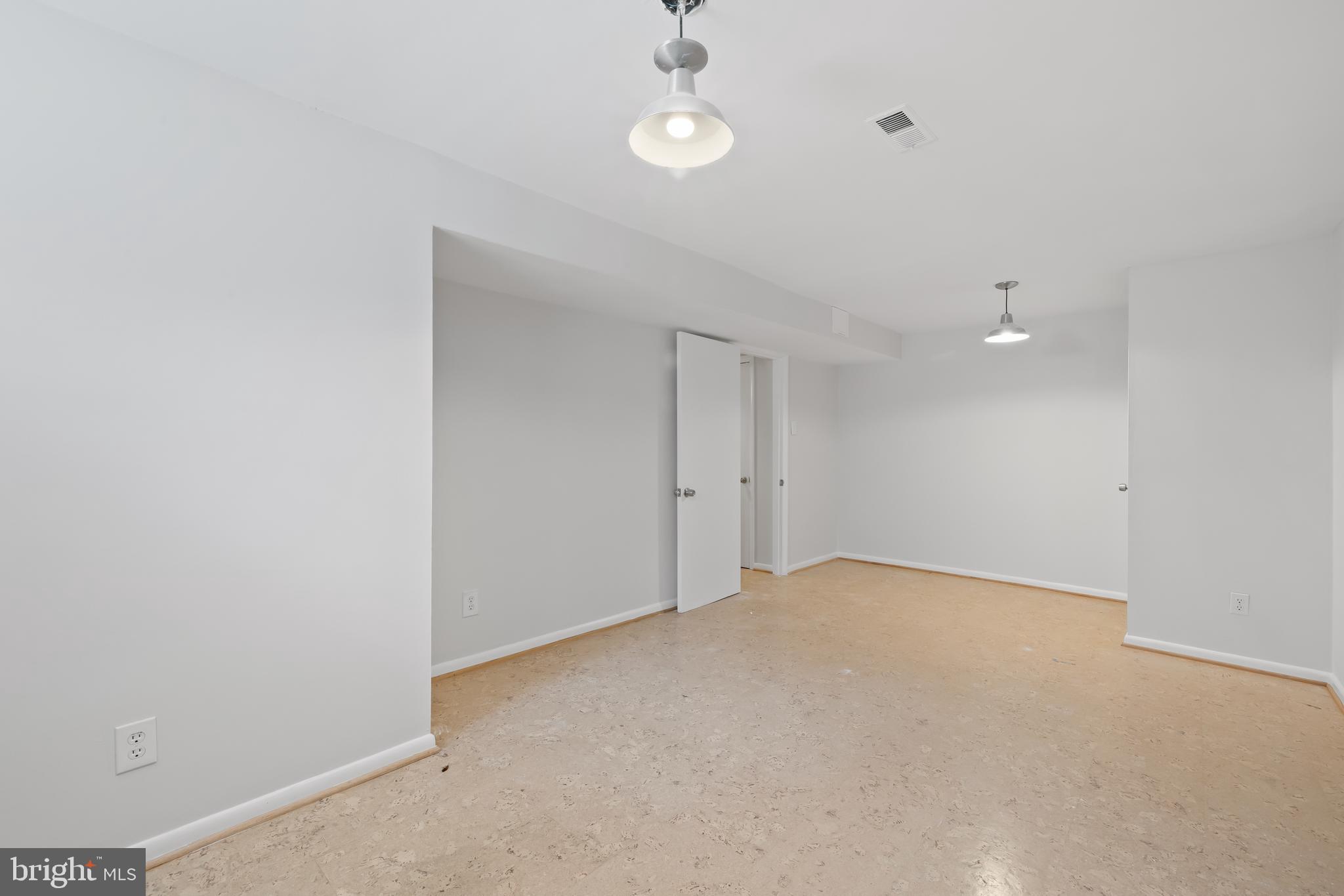 6721 Kenwood Forest Lane, Unit 45 Chevy Chase, MD 20815 - Photo 26 of 35 wooden floor in an empty room