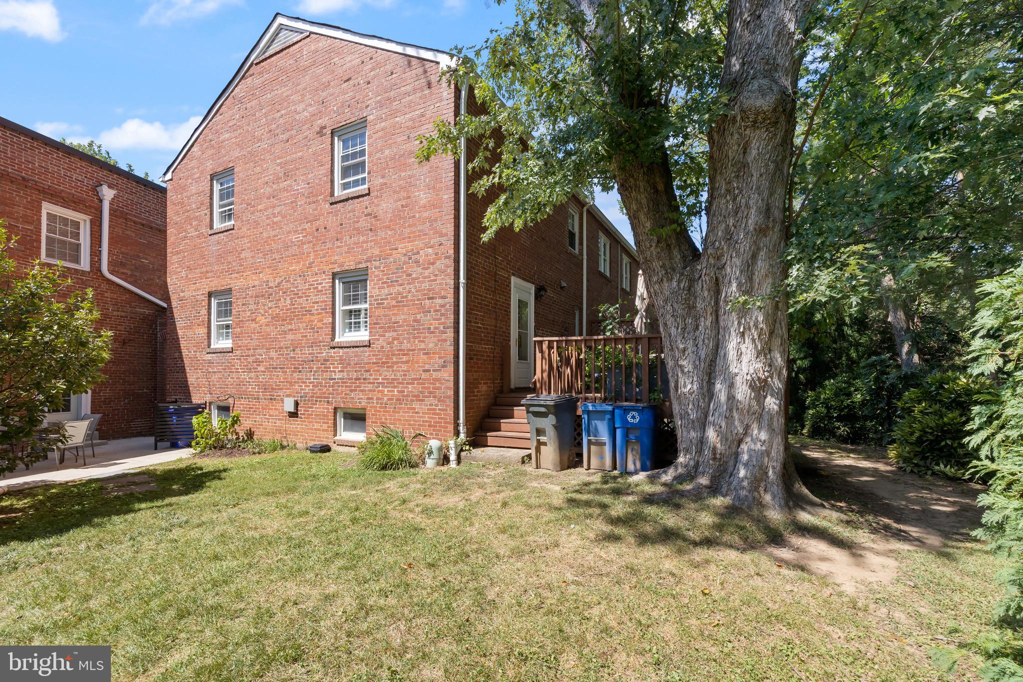 6721 Kenwood Forest Lane, Unit 45 Chevy Chase, MD 20815 - Photo 30 of 35 a view of a house with a yard