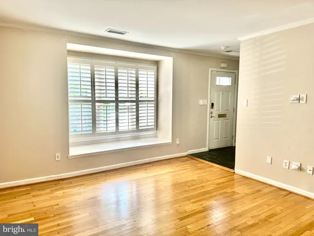 a kitchen with stainless steel appliances granite countertop a sink dishwasher a stove and a microwave oven with cabinets