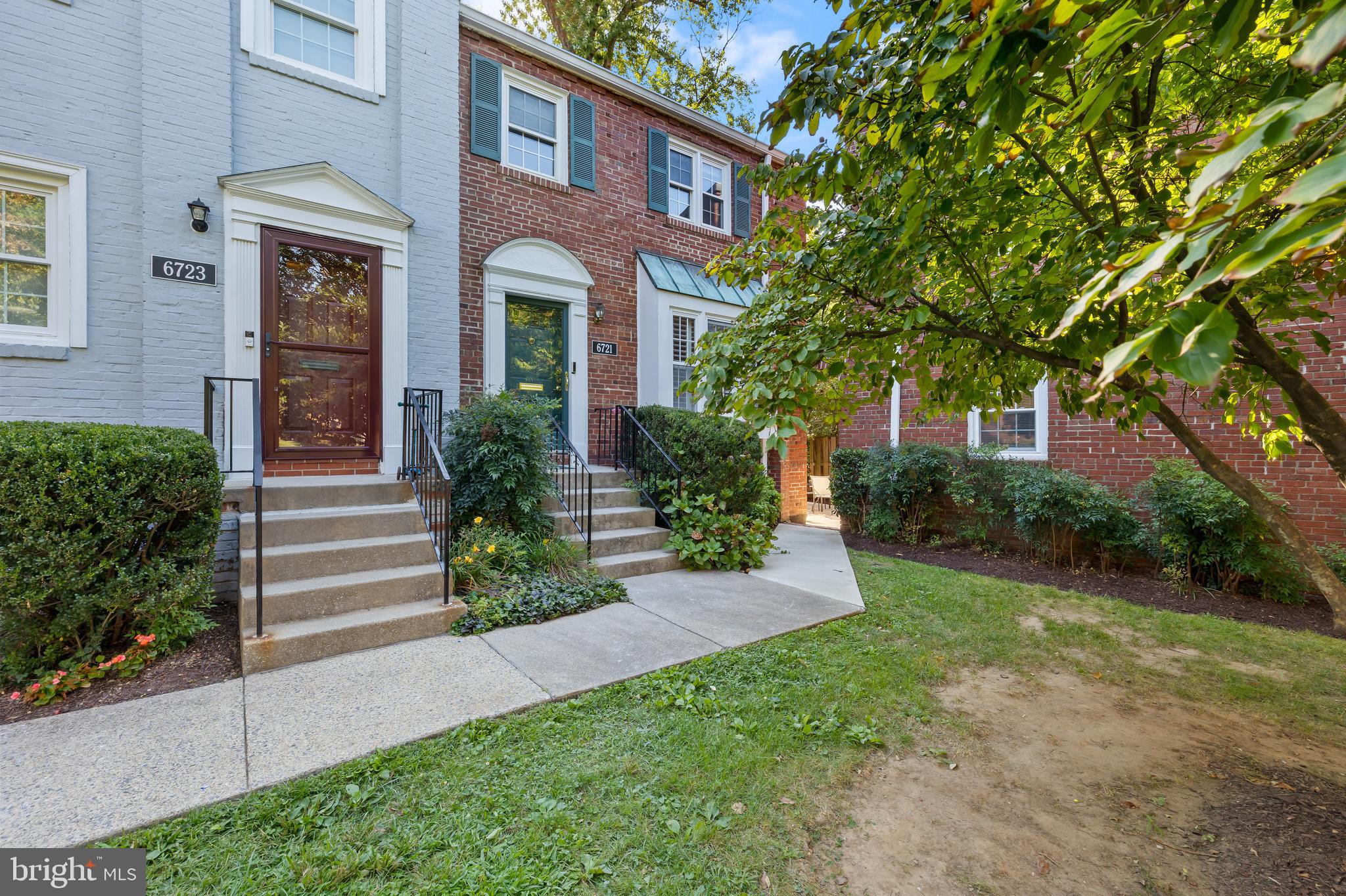 6721 Kenwood Forest Lane, Unit 45 Chevy Chase, MD 20815 - Photo 35 of 35 a front view of a house with garden