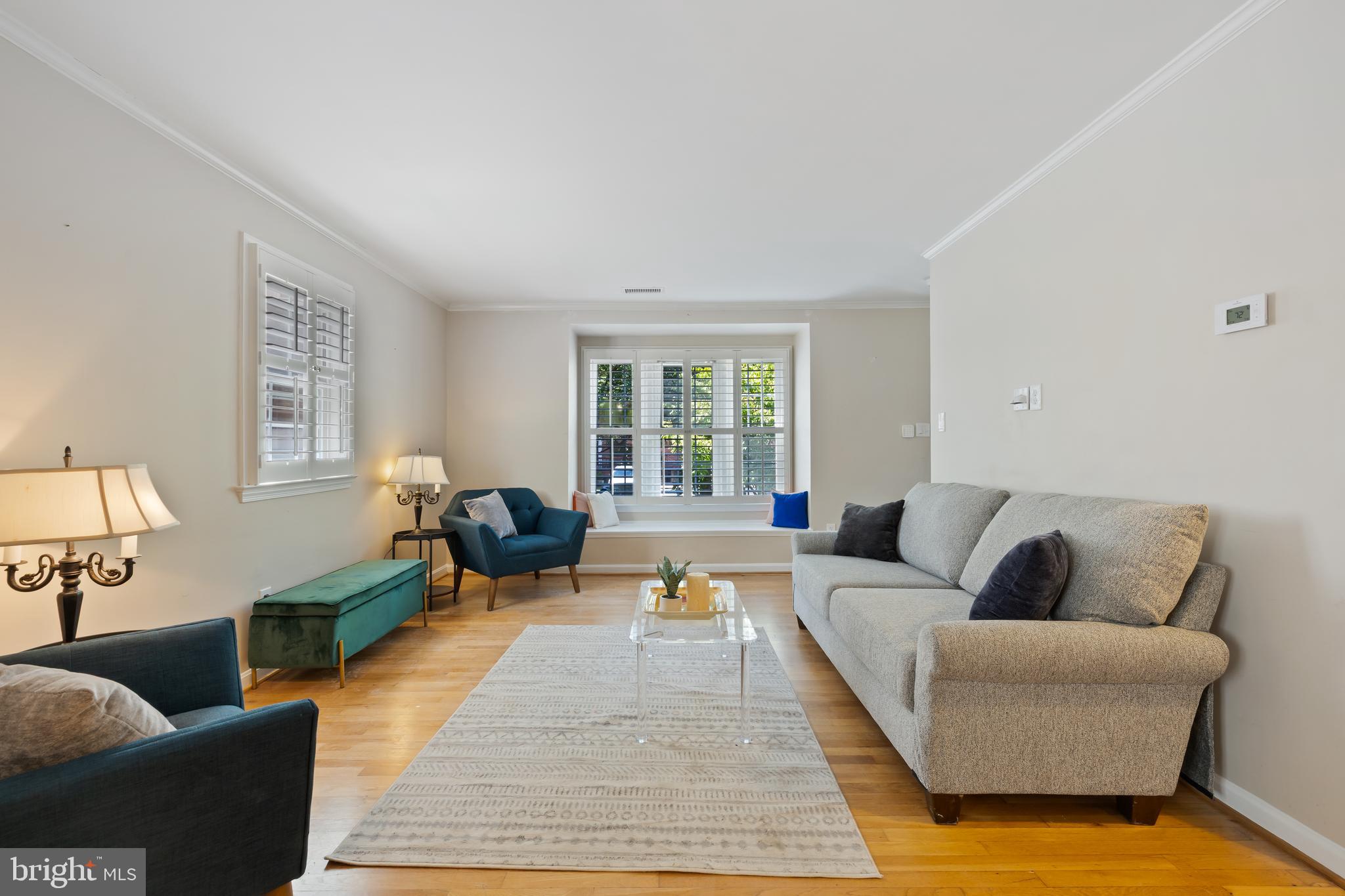 6721 Kenwood Forest Lane, Unit 45 Chevy Chase, MD 20815 - Photo 5 of 35 a living room with furniture and a couch
