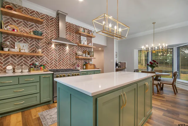 a living room with fireplace furniture and a large window