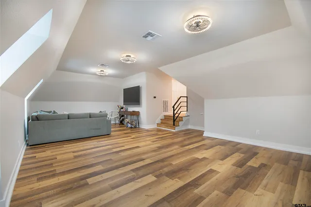 a bed room with a bed and a chandelier