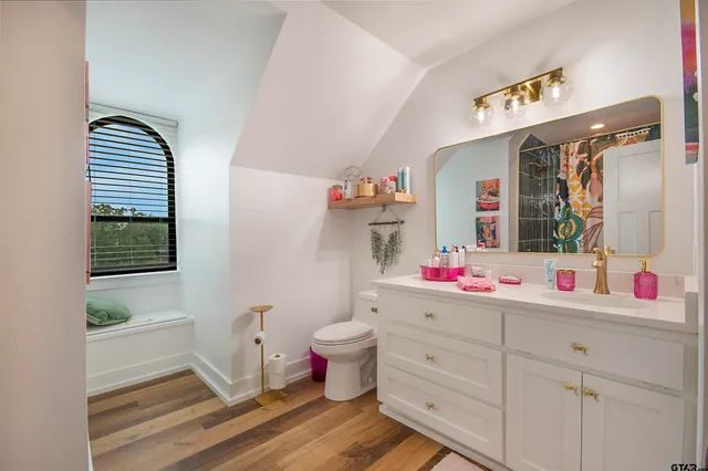 a bedroom with a bed and a couch