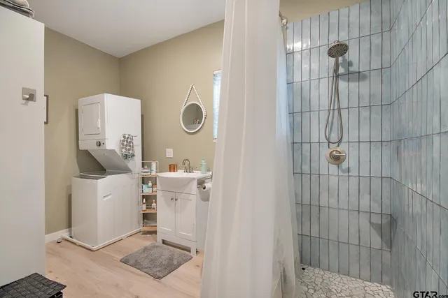 a bedroom with a bed and a mirror