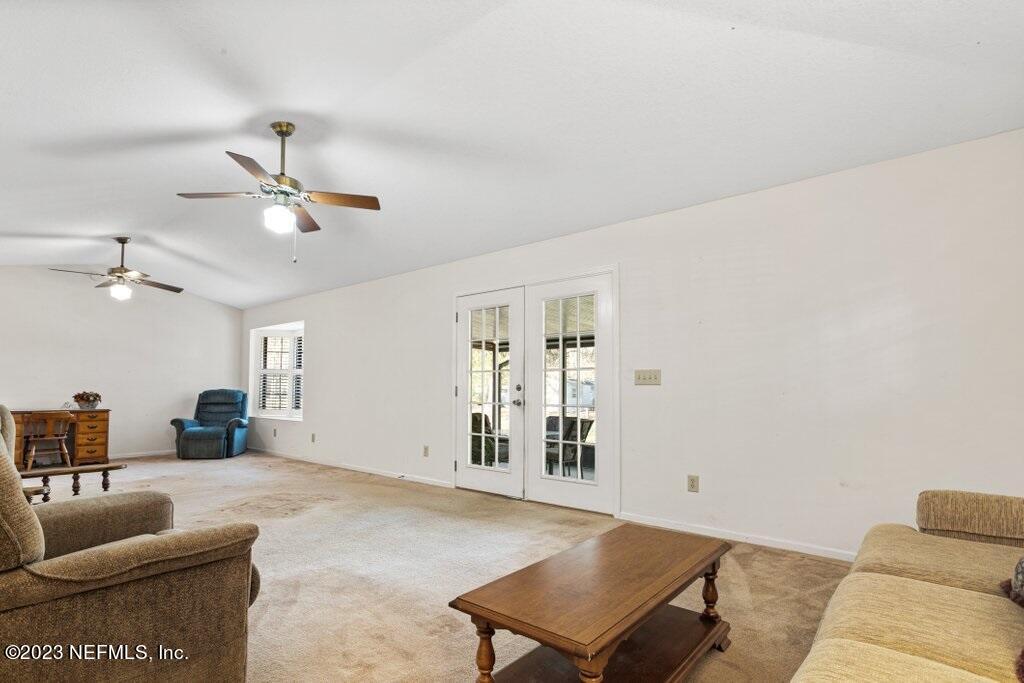 1271 Sheffield Road Jacksonville, FL 32259 - Photo 11 of 19 a living room with furniture and kitchen view