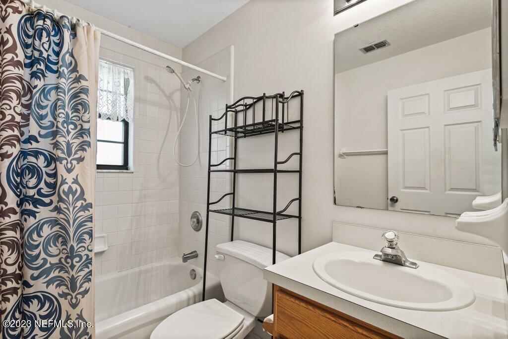 1271 Sheffield Road Jacksonville, FL 32259 - Photo 12 of 19 a bathroom with a sink toilet and shower
