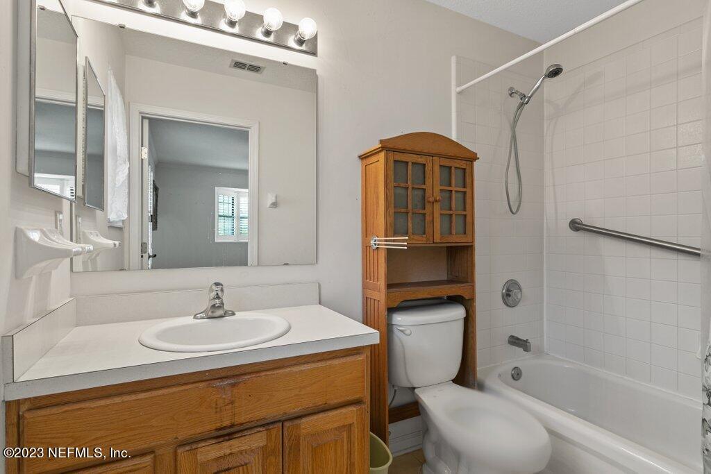 1271 Sheffield Road Jacksonville, FL 32259 - Photo 14 of 19 a bathroom with a sink toilet and shower