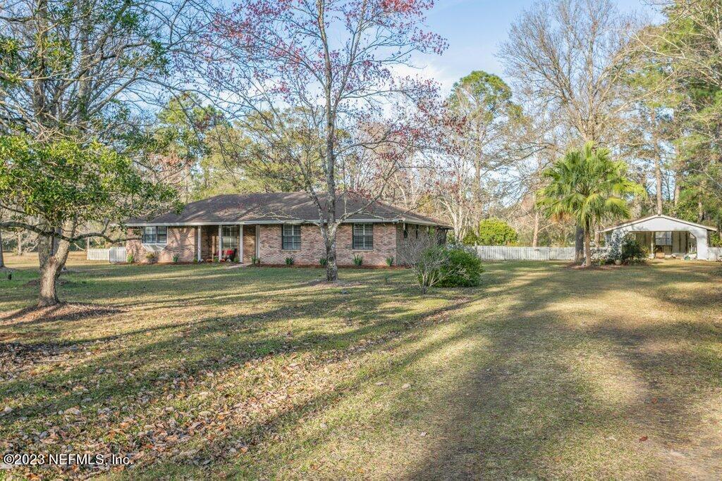 1271 Sheffield Road Jacksonville, FL 32259 - Photo 5 of 19 a front view of a house with a yard