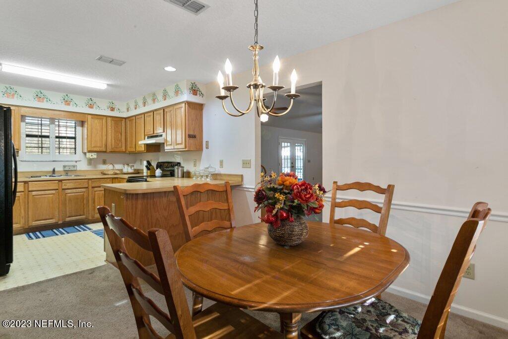 1271 Sheffield Road Jacksonville, FL 32259 - Photo 10 of 19 a view of a dining room with furniture