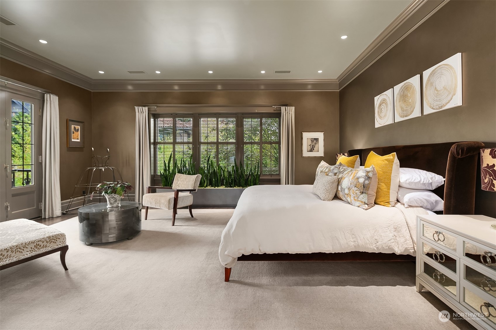 1121 22nd Avenue East Seattle, WA 98112 - Photo 15 of 40 a bedroom with a large bed and a large window