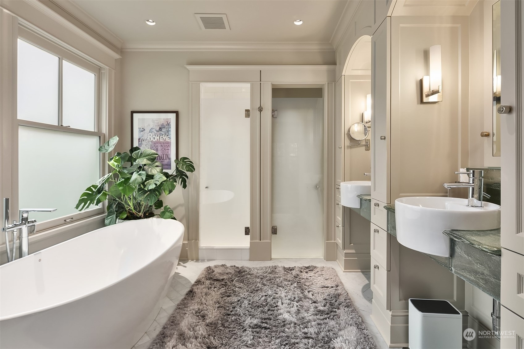 1121 22nd Avenue East Seattle, WA 98112 - Photo 16 of 40 a bathroom with a tub sink and mirror