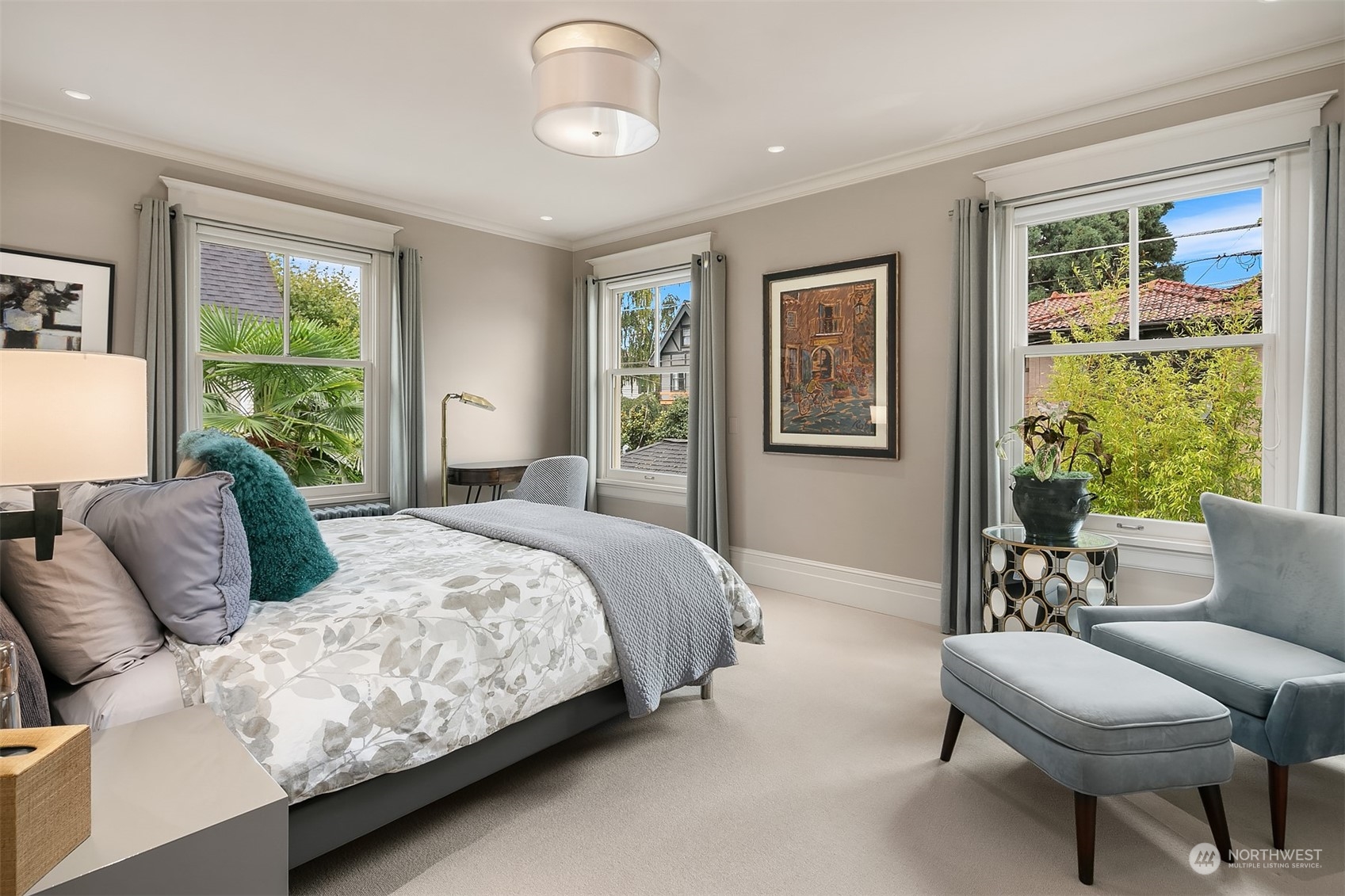 1121 22nd Avenue East Seattle, WA 98112 - Photo 19 of 40 a bedroom with a large bed and a couch