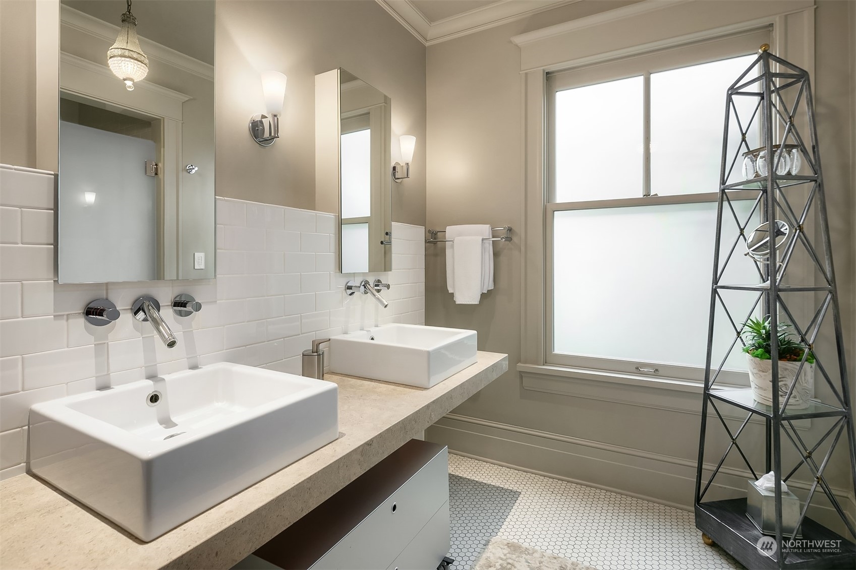 1121 22nd Avenue East Seattle, WA 98112 - Photo 22 of 40 a bathroom with a sink and a mirror
