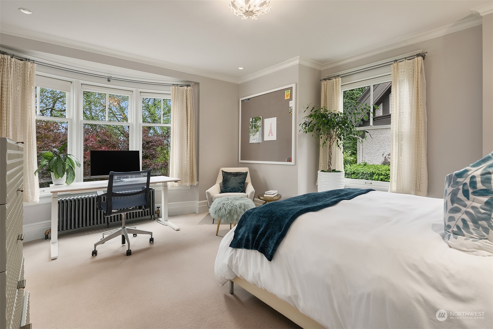 1121 22nd Avenue East Seattle, WA 98112 - Photo 23 of 40 a bedroom with a bed window and table chair