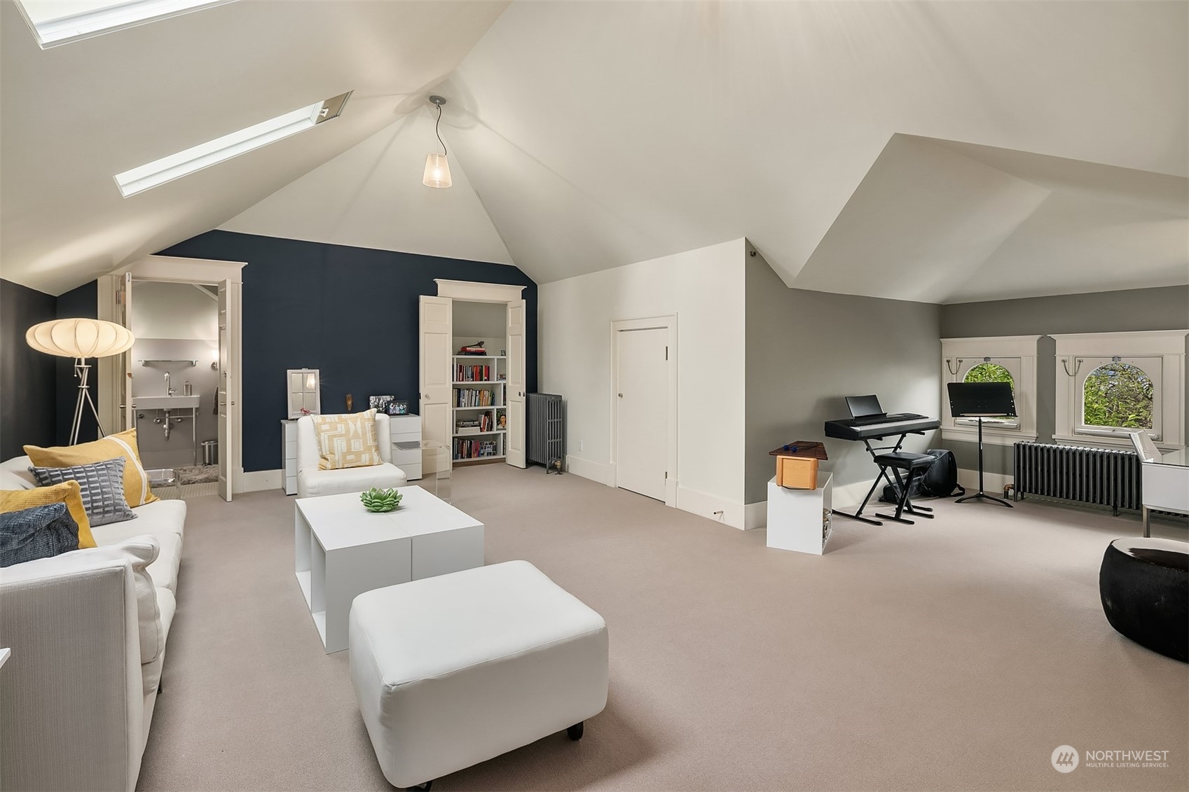 1121 22nd Avenue East Seattle, WA 98112 - Photo 24 of 40 a living room with furniture and a dining table with kitchen view