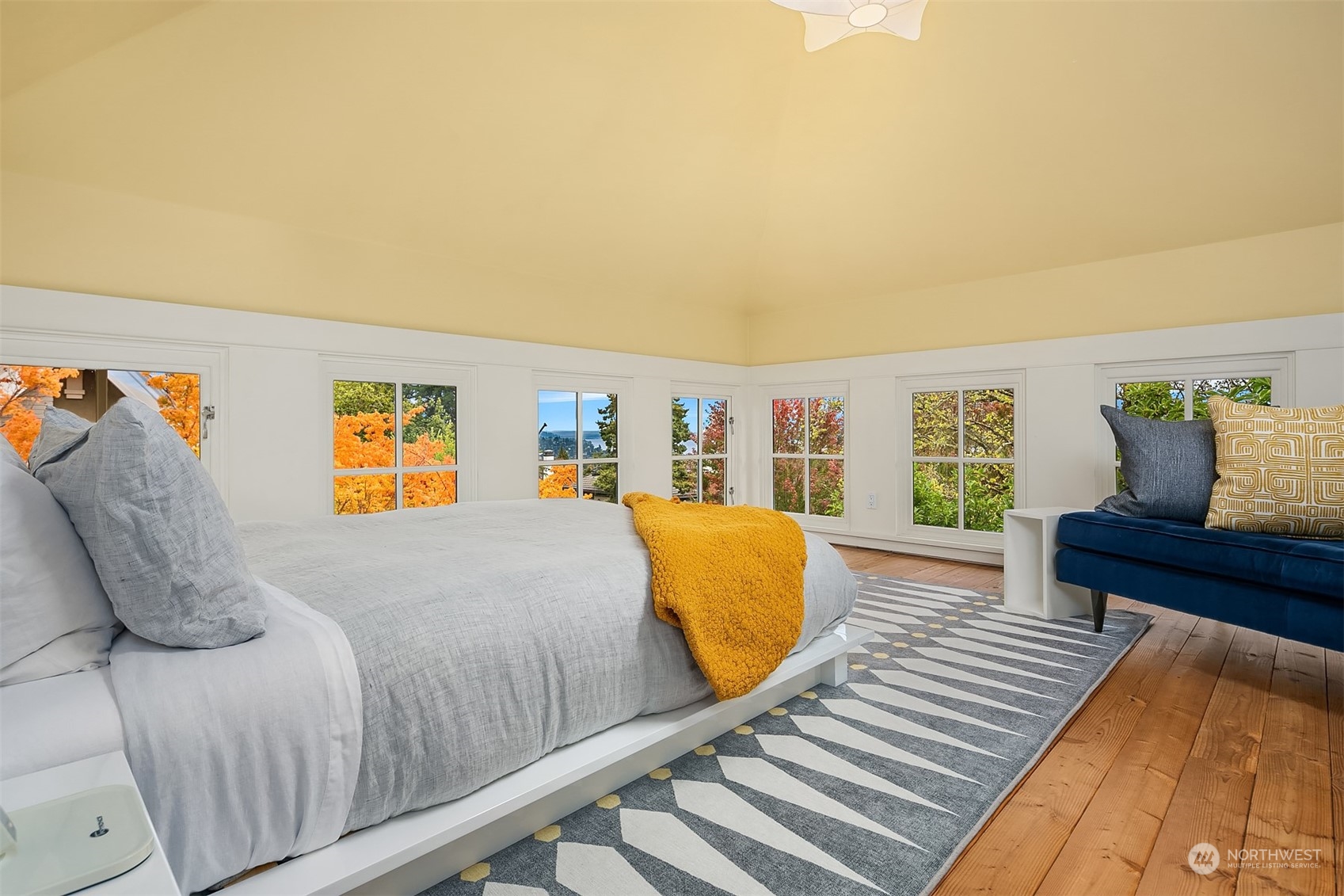 1121 22nd Avenue East Seattle, WA 98112 - Photo 25 of 40 a bedroom with a bed and wooden floor
