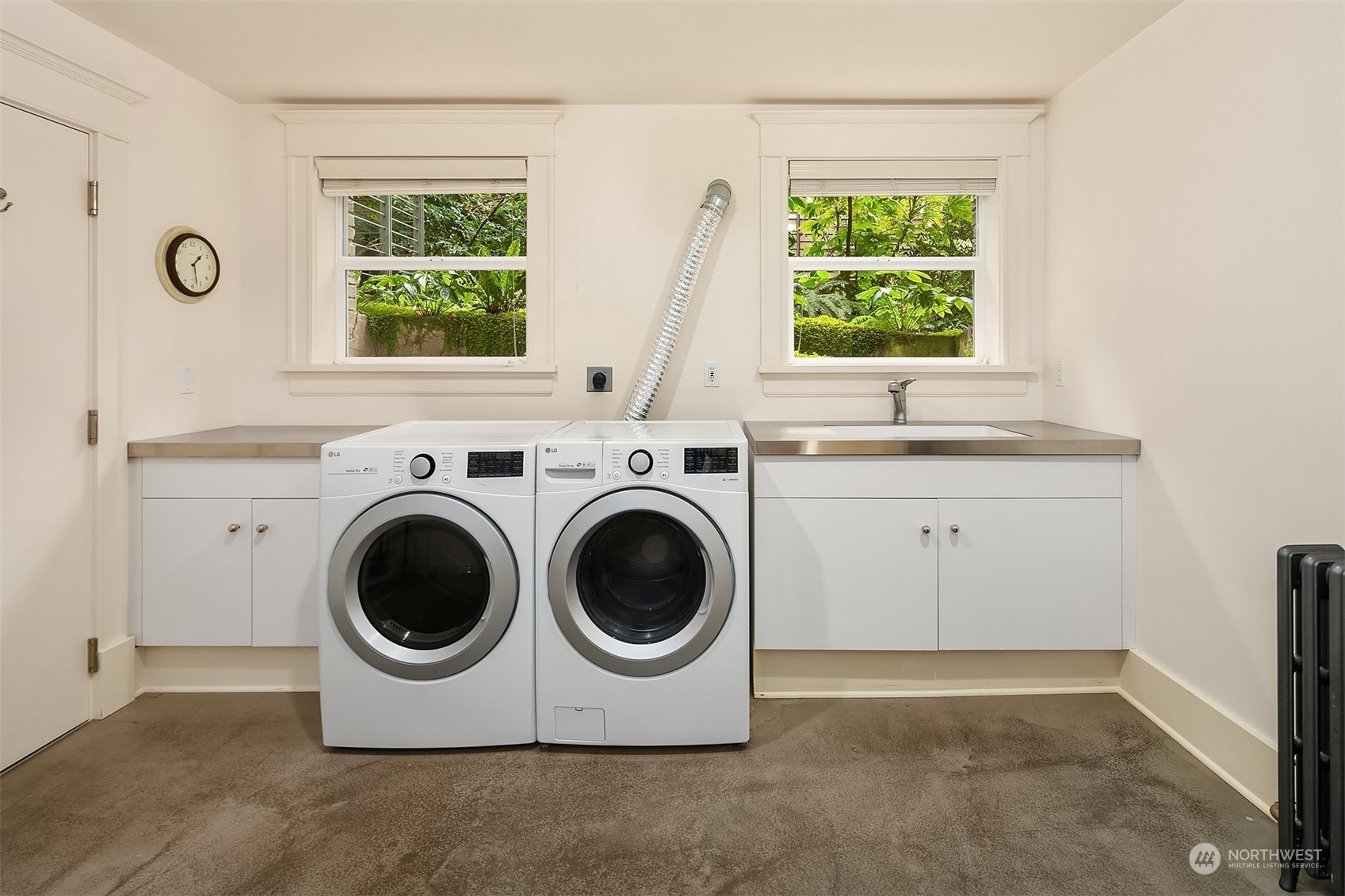 1121 22nd Avenue East Seattle, WA 98112 - Photo 30 of 40 a utility room with dryer and washer