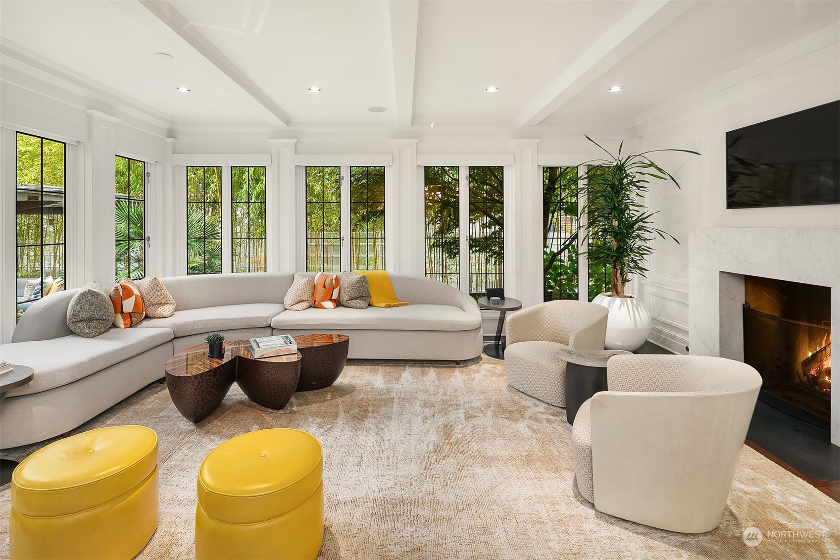 1121 22nd Avenue East Seattle, WA 98112 - Photo 9 of 40 a living room with fireplace furniture and a flat screen tv