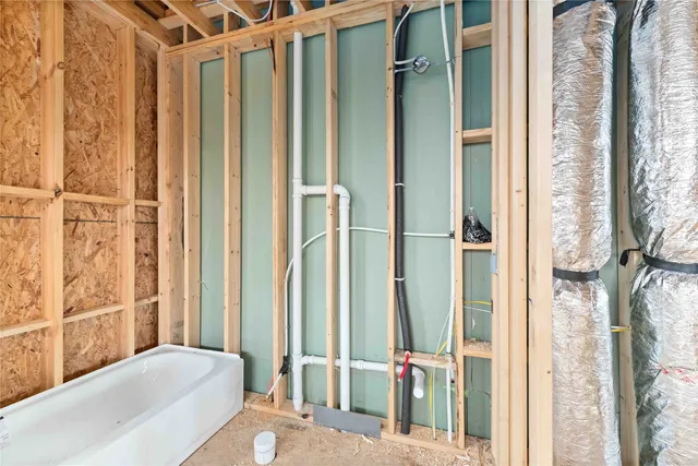 a view of a porch with furniture and front door