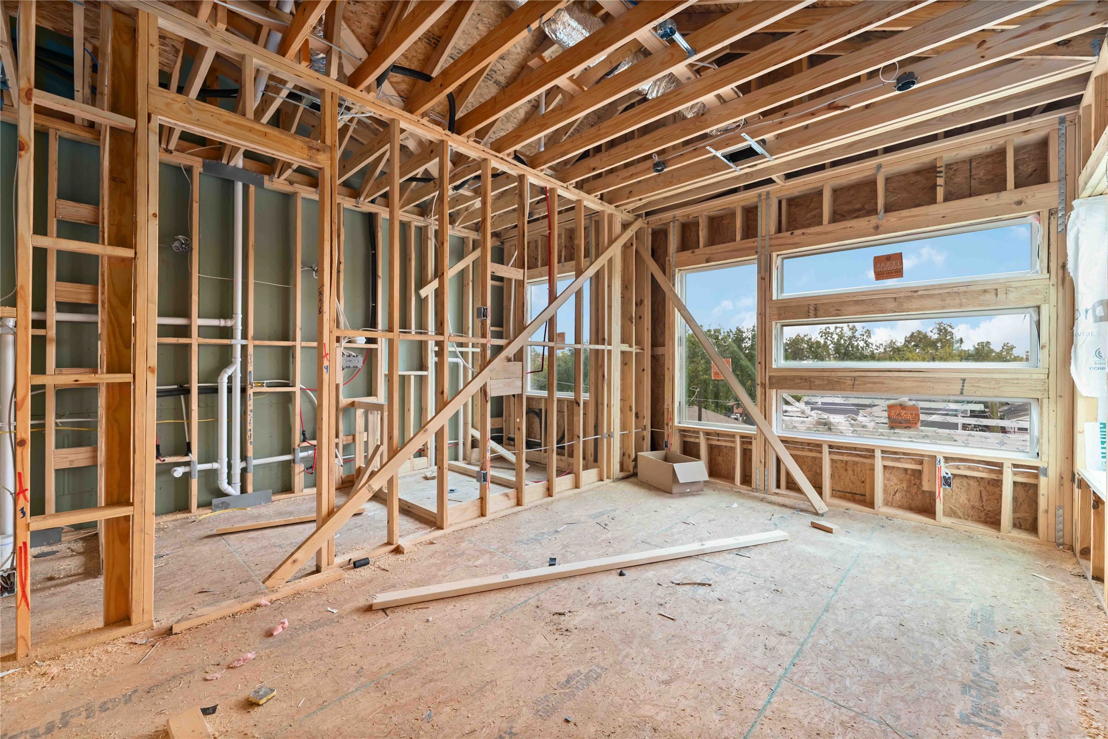 3103 Lelia Street, Unit A Houston, TX 77026 - Photo 21 of 33 a view of a hall with wooden floor and windows