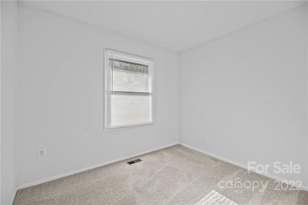 2328 Weddington Road Charlotte, NC 28270 - Photo 16 of 24 an empty room with a window