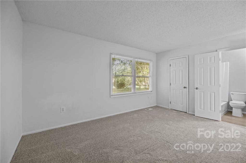 2328 Weddington Road Charlotte, NC 28270 - Photo 21 of 24 a view of an empty room with a window