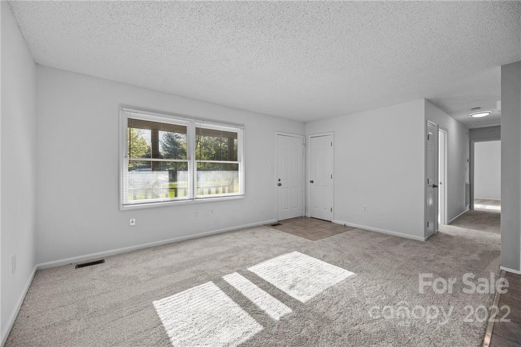 2328 Weddington Road Charlotte, NC 28270 - Photo 10 of 24 a view of an empty room with a window