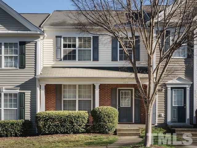 4213 Vienna Crest Drive Raleigh, NC 27613 - Photo 1 of 24 a view of a brick house with large windows