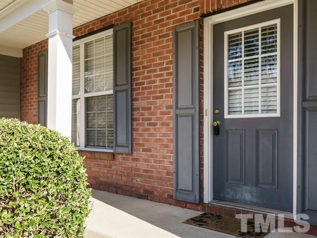 4213 Vienna Crest Drive Raleigh, NC 27613 - Photo 2 of 24 a front view of a house with a yard