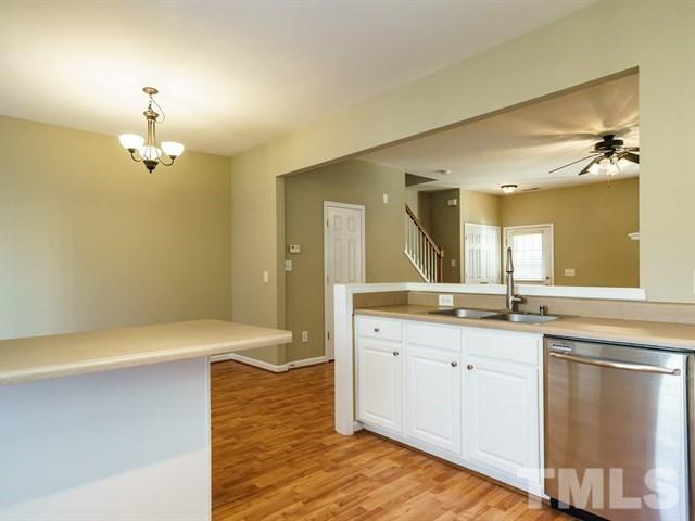 4213 Vienna Crest Drive Raleigh, NC 27613 - Photo 14 of 24 a spacious bathroom with a granite countertop sink a toilet and a mirror