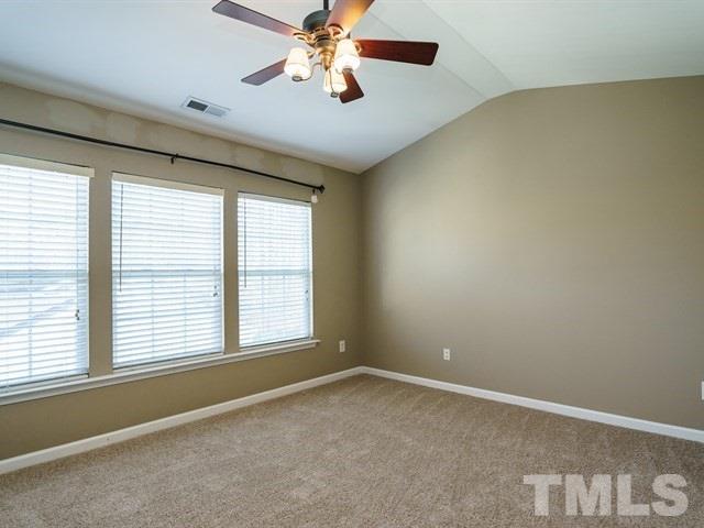 4213 Vienna Crest Drive Raleigh, NC 27613 - Photo 17 of 24 a view of an empty room with a window