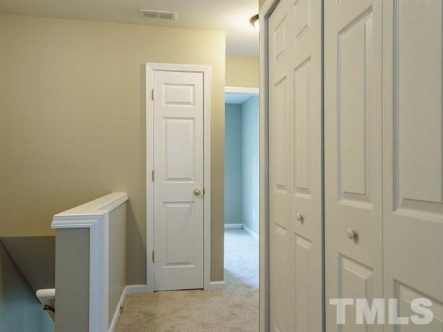 4213 Vienna Crest Drive Raleigh, NC 27613 - Photo 19 of 24 a view of a bathroom from the hallway