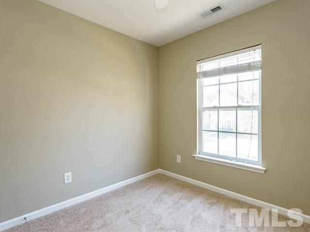 4213 Vienna Crest Drive Raleigh, NC 27613 - Photo 22 of 24 an empty room with a window