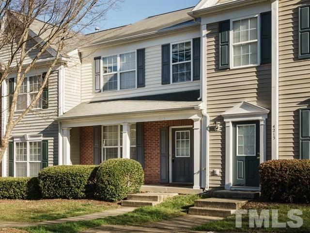 4213 Vienna Crest Drive Raleigh, NC 27613 - Photo 24 of 24 a front view of a house with a yard