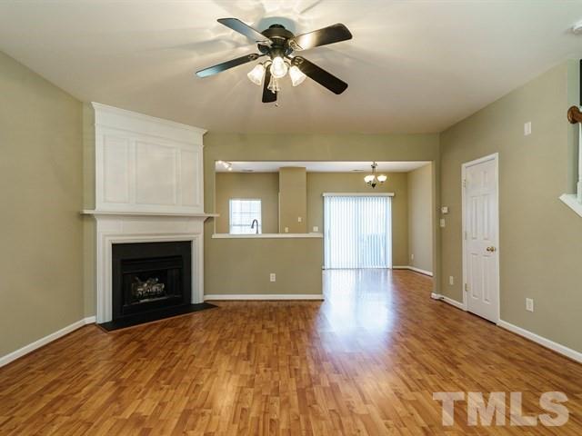 4213 Vienna Crest Drive Raleigh, NC 27613 - Photo 7 of 24 a view of empty room with wooden floor and fan