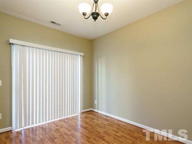 4213 Vienna Crest Drive Raleigh, NC 27613 - Photo 9 of 24 an empty room with a window