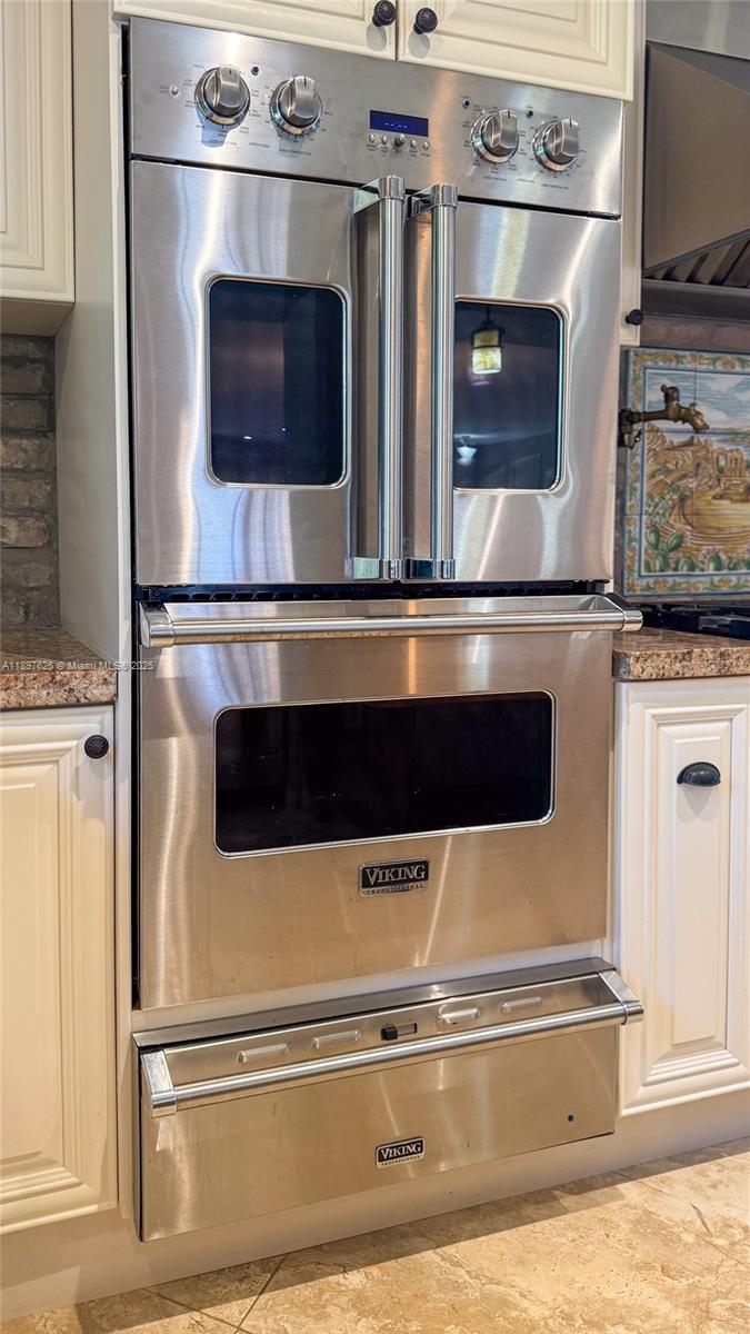 11851 Northwest 7th Street Plantation, FL 33325 - Photo 11 of 72 a close view of a stove top oven and refrigerator