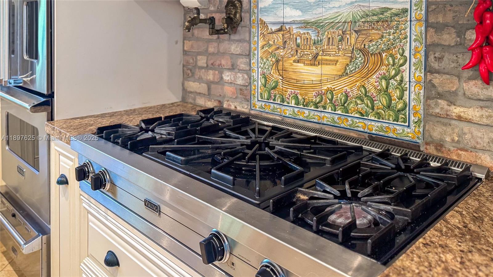 11851 Northwest 7th Street Plantation, FL 33325 - Photo 12 of 72 a close up of a stove top oven sitting on a counter