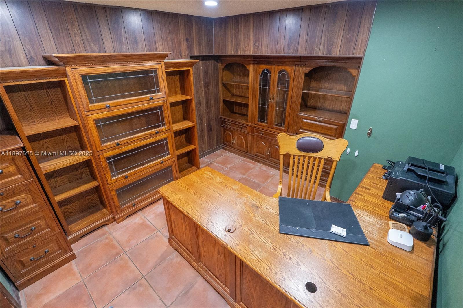 11851 Northwest 7th Street Plantation, FL 33325 - Photo 16 of 72 a kitchen with wooden cabinets and a stove top oven