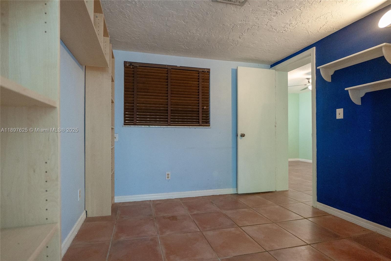 11851 Northwest 7th Street Plantation, FL 33325 - Photo 19 of 72 a view of an empty room with a window